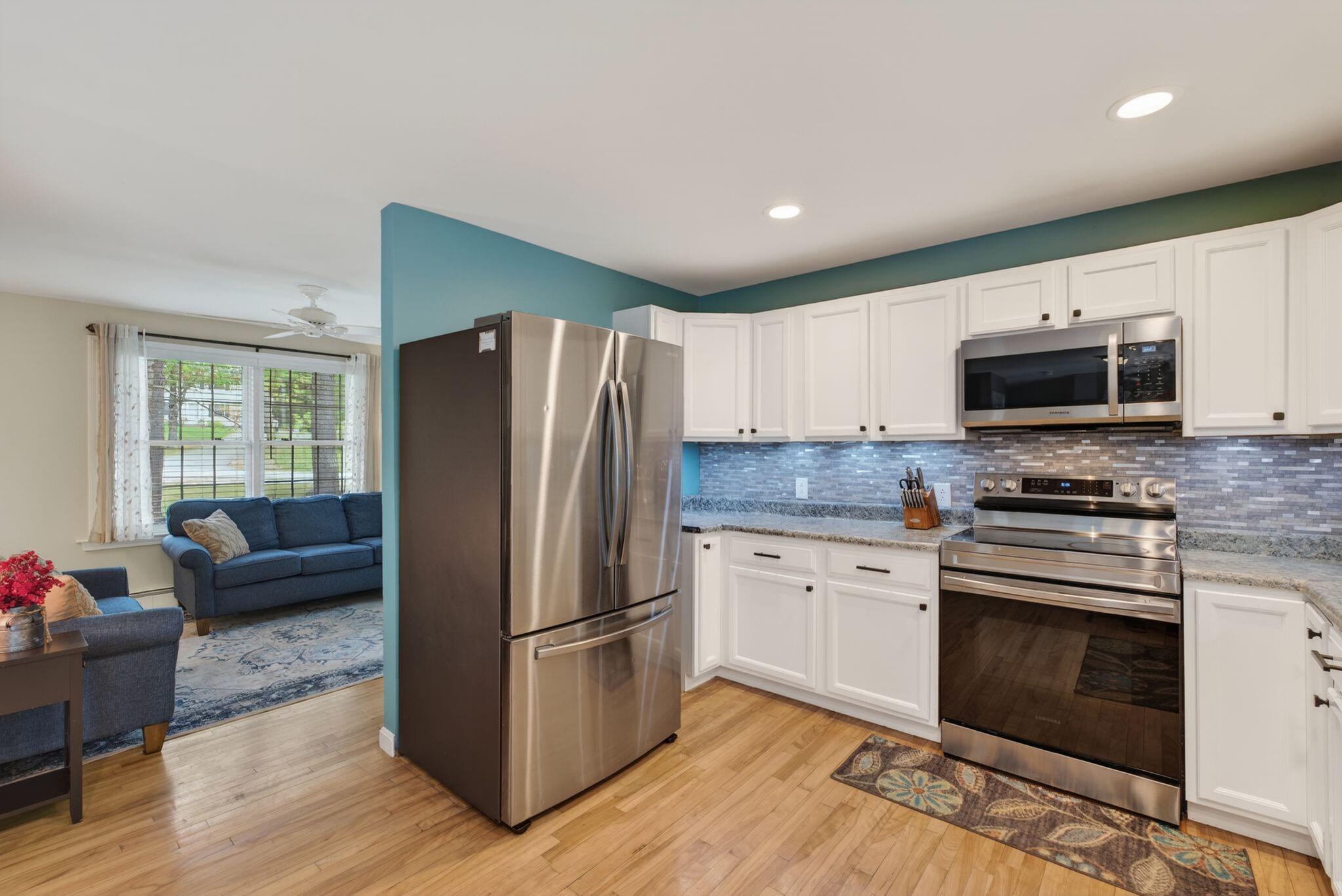 Kitchen with walk in pantry and access to backyard deck