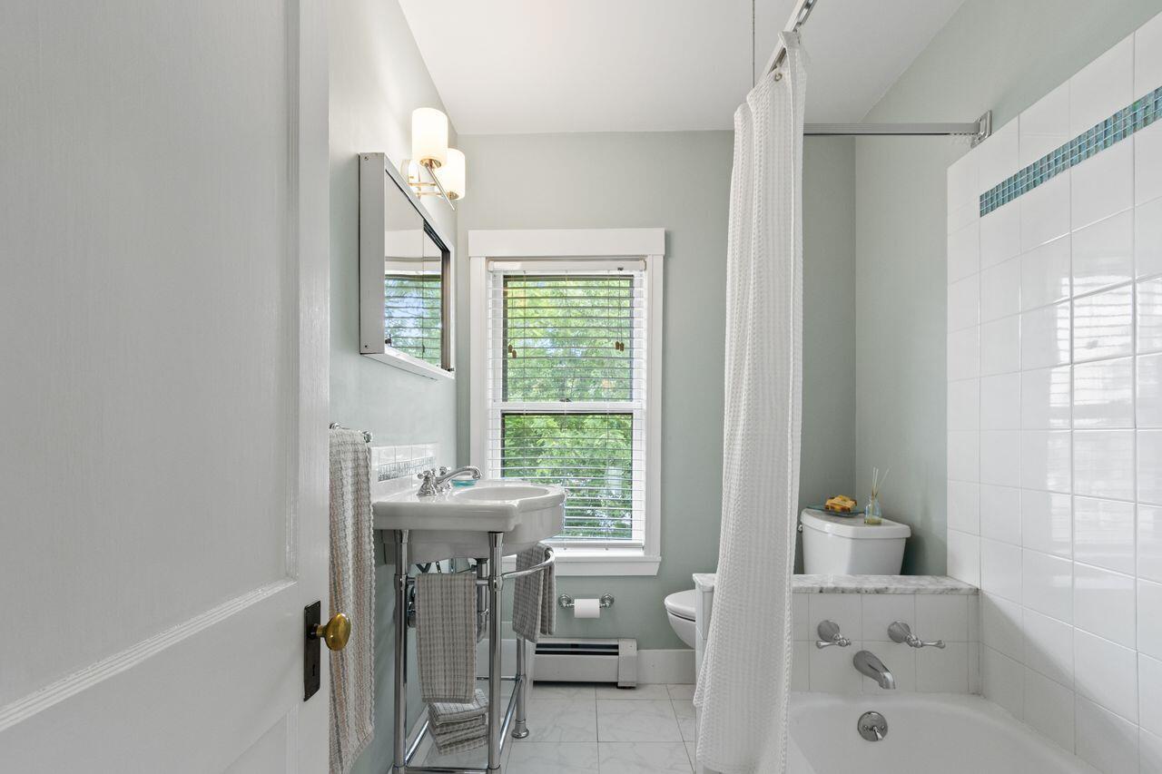 14 Holly Street, Portland, ME 04103 Full bath on second level features tiled flooring, tiled tub/shower