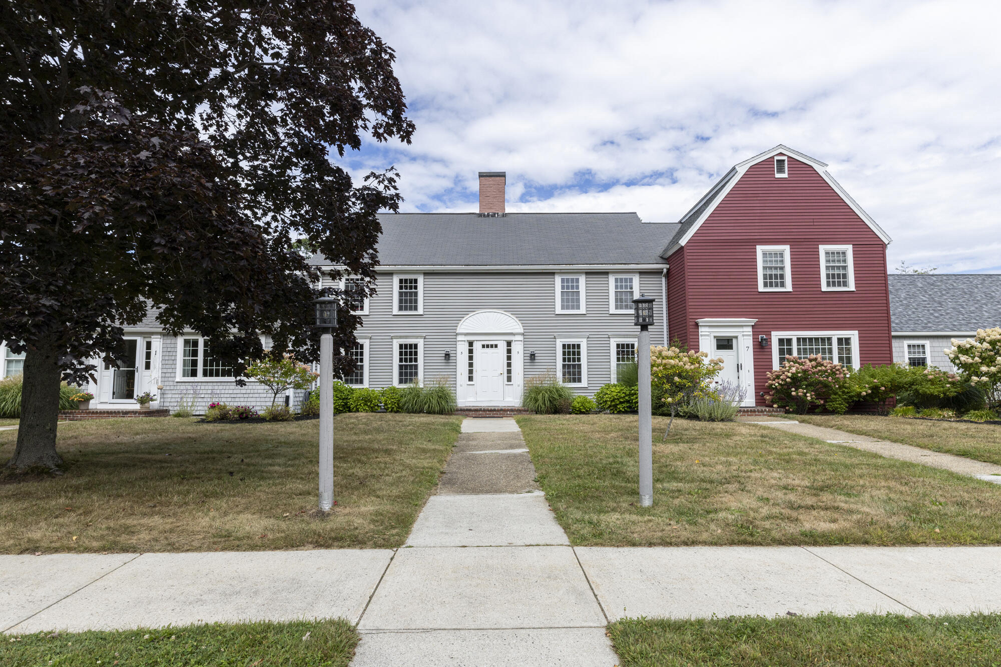 Welcome to this charming 2BR/1.5BA condo in Cape Elizabeth where comfort, character, and location come together. Whether you're looking for a full-time home, a weekend retreat, or a simpler way to enjoy coastal Maine, this inviting condo makes it easy to embrace the lifestyle you've been looking for. The living room features beautiful wood floors and large built-in bookcases, adding warmth, character, and plenty of space to showcase your favorite books and treasures. The bright U-shaped kitchen is both cheerful and functional, with an efficient layout that makes cooking and entertaining a breeze. Step outside through the back slider to discover a nice patio overlooking a lovely, quiet backyard—a peaceful spot for morning coffee, al fresco dining, or just relaxing at the end of the day. A one-car garage adds valuable storage and convenience, especially during Maine's winter months. And then there's the location! You're close to Cape Elizabeth's spectacular beaches and state parks, along with local restaurants, shops, and a nearby golf course. When you're ready for a little city energy, downtown Portland is just a short drive away, putting world-class dining, arts, entertainment, and shopping within easy reach. A charming home, a peaceful setting, and the best of coastal Maine right outside your door—what's not to love? This home has even been pre-inspected for the buyer's convenience. Seller Concessions Available. For a video walk-thru go to YouTube and enter the property address.