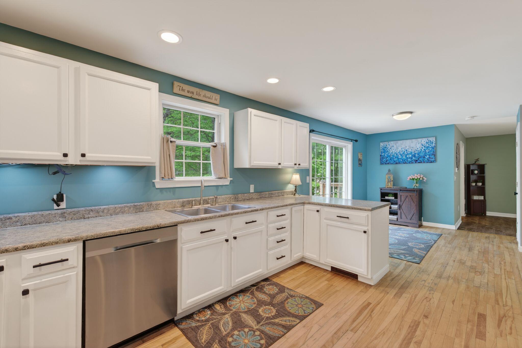 Kitchen with walk in pantry and access to backyard deck