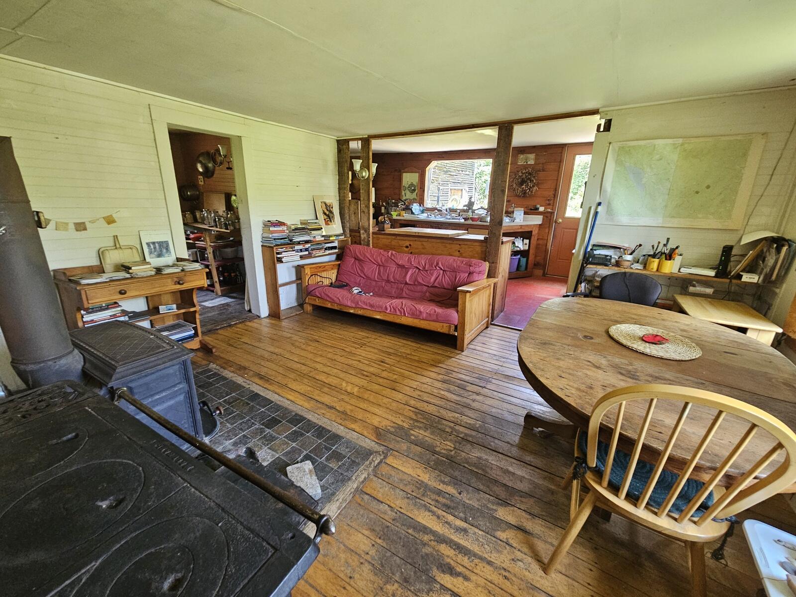 Dining room with kitchen in background as seen from the entry