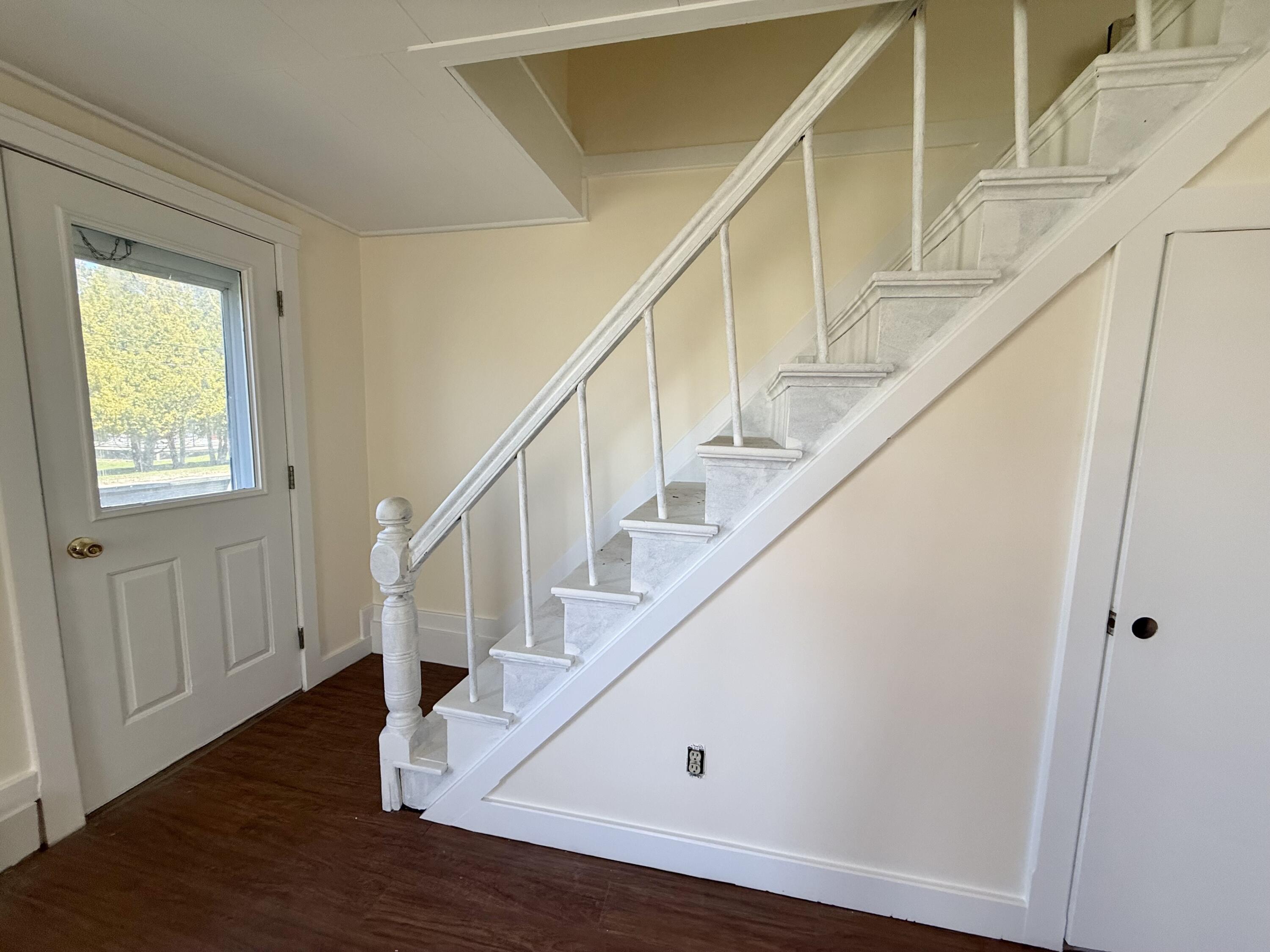 Front door entrance by staircase