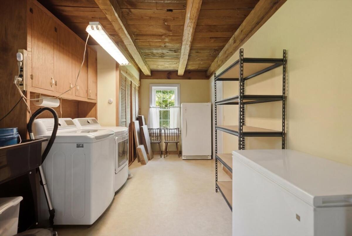 Storage and laundry room with oversized sink