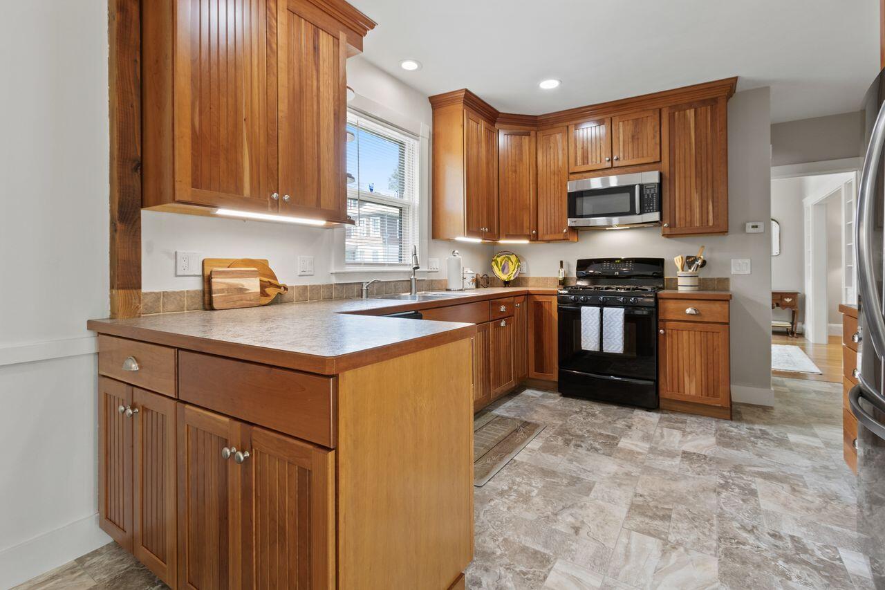 14 Holly Street, Portland, ME 04103 Kitchen features a gas cook range and s/s microwave and refrigerator