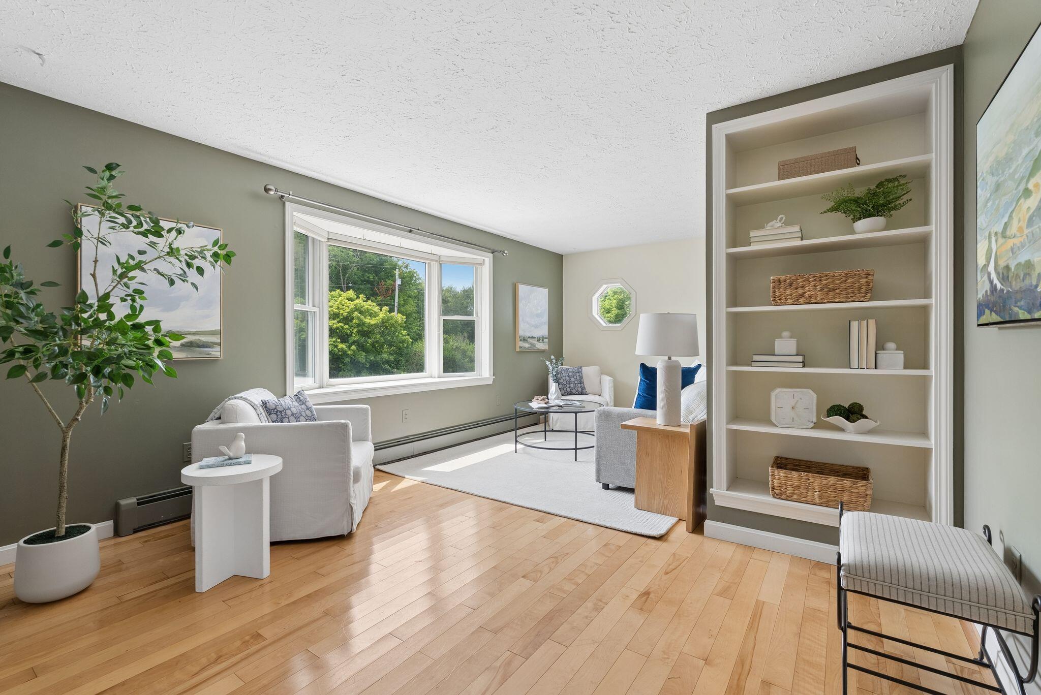 155 Ridge Road, Lisbon, ME 04252 The living room features built-ins and a bay window.