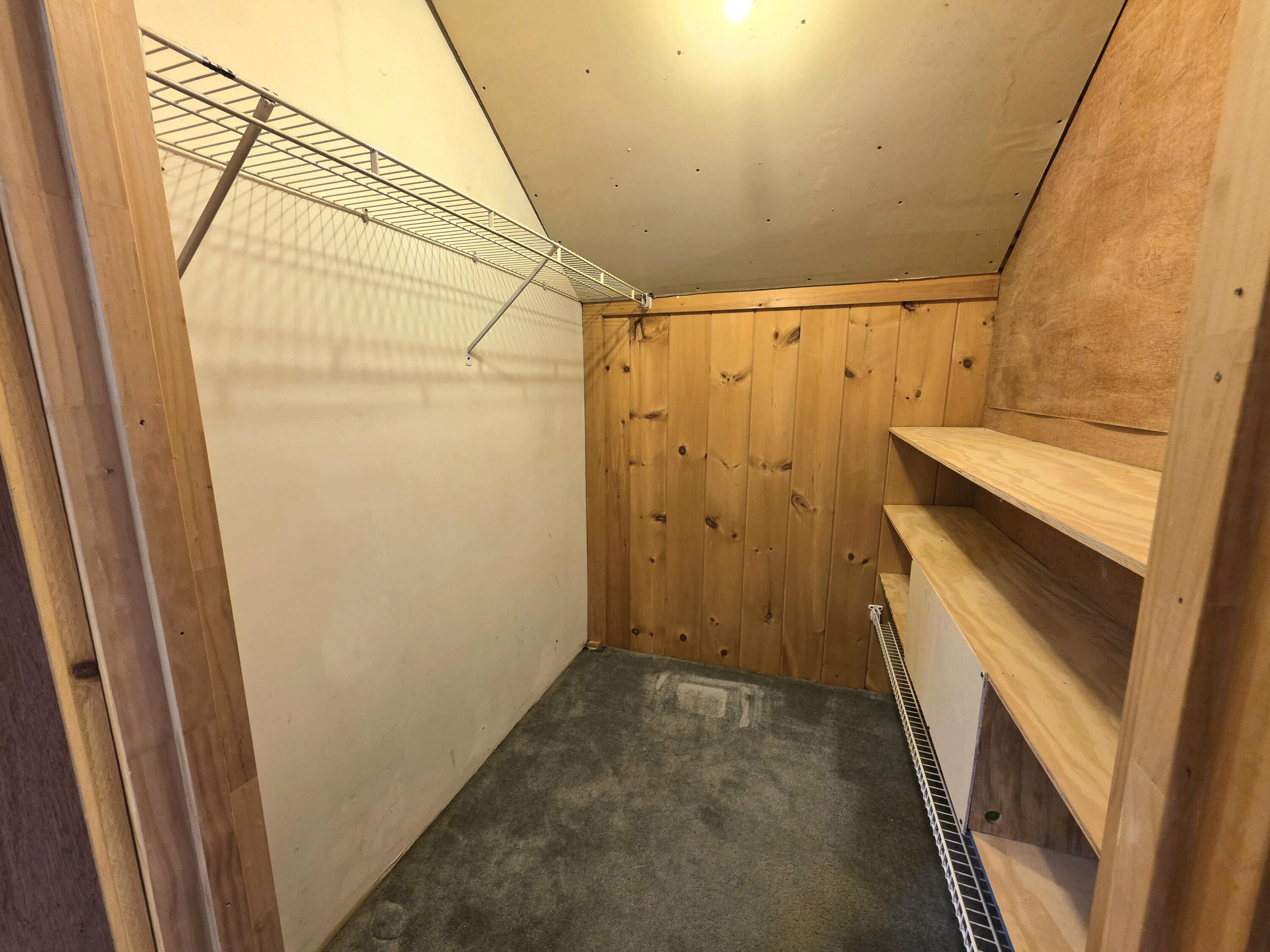walk in closet of loft